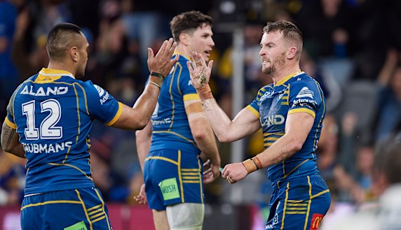 Marata Niukore and Clint Gutherson celebrate an Eels try.