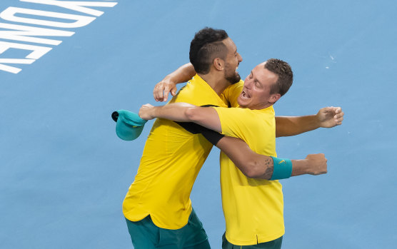 Kyrgios and Hewitt embrace after victory over Team GB in the ATP Cup in Sydney.