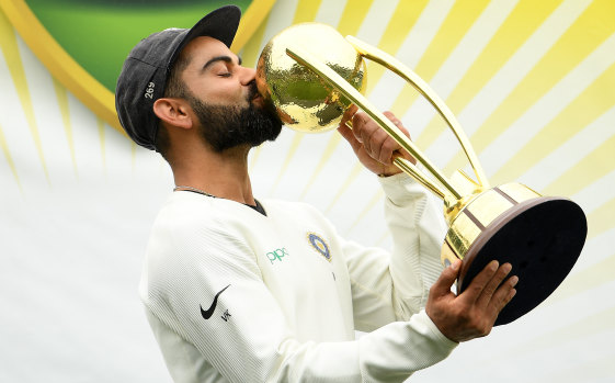 Moment to savour: Triumphant captain Virat Kohli celebrates India's historic series win on Monday.