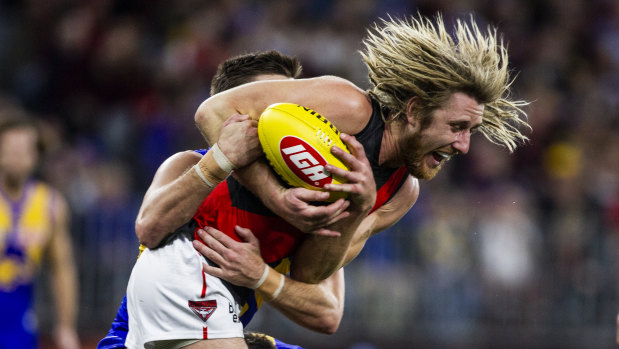 Dyson Heppell gets tackled on Thursday night in the loss to West Coast.