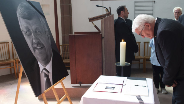 Federal President Frank-Walter Steinmeier bows his head at the multi-religious peace service "Peace needs courage" after signing a condolence book for Walter Luebcke last month.