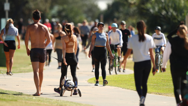People walk along Miami foreshore  on the Gold Coast earlier this month