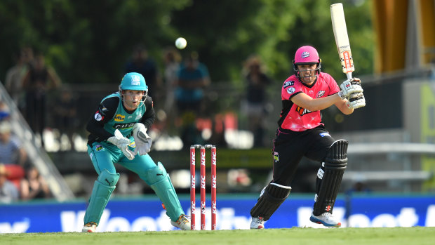 Justin Avendano (right) of the Sydney Sixers in action during the BBL match between the Brisbane Heat and the Sixers at Metricon Stadium on the Gold Coast on Tuesday.