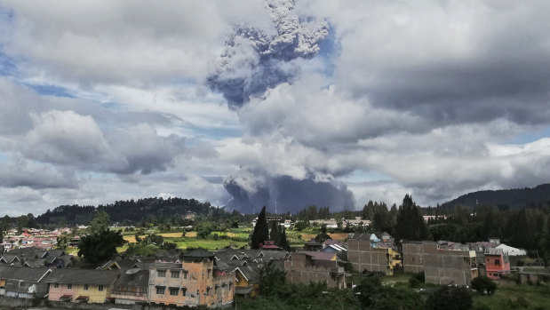 Mount Sinabung spews volcanic materials into the air as it erupts, in Karo, North Sumatra, Indonesia, on Monday.