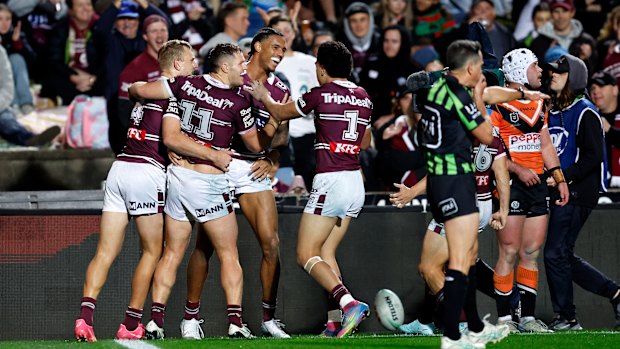 The Sea Eagles celebrate a Jason Saab try.