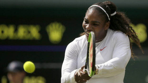 Serena Williams returns a shot to Evgeniya Rodina.