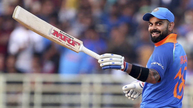 Unstoppable: Virat Kohli celebrates scoring 10,000 ODI runs.