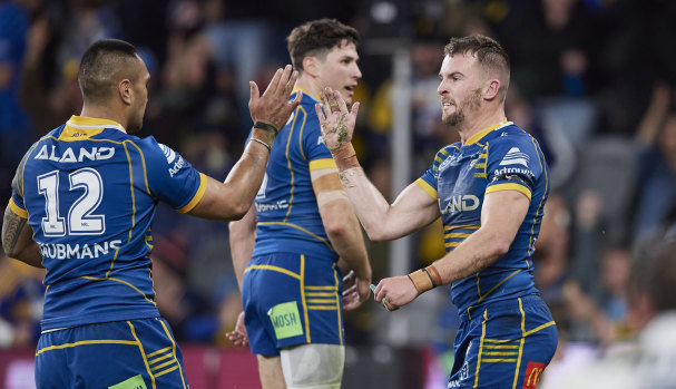 Marata Niukore and Clint Gutherson celebrate an Eels try.