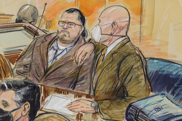 This artist sketch depicts Guy Wesley Reffitt, joined by his lawyer William Welch.