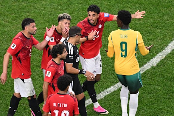 Egyptian players argues with referee Gustavo Tejera after Souttar (not pictured) contests the ball. 