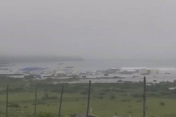 The tsunami hits the coastal area of Severo-Kurilsk at Paramushir Island of Kuril Islands, Russia, on Wednesday.