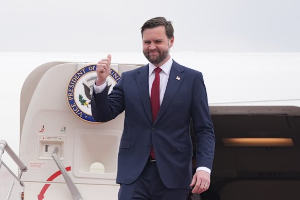 US Vice President JD Vance disembarks from Air Force Two. 