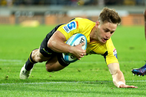 Brett Cameron of the Hurricanes scores a try.