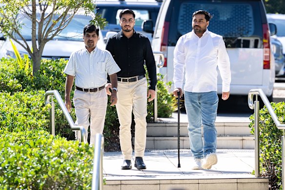 Musawar Ahmad Bashir and Muzafar Ahmad Tahir,  the brothers of murdered security guard Faraz Tahir, arrive at the court.