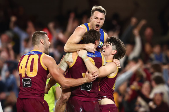 The Lions celebrate their last goal.