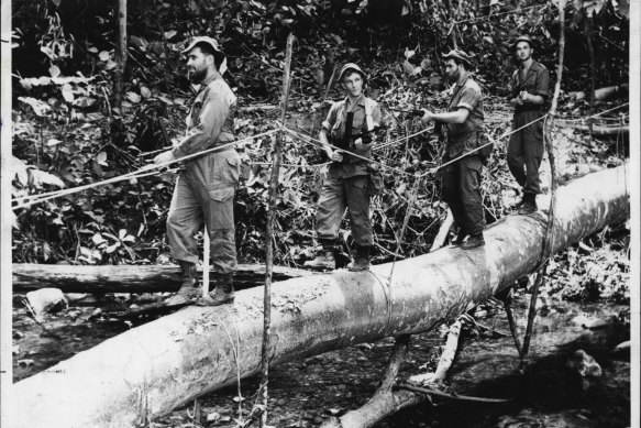 Australian troops searching for terrorists hidden in jungle during the Malaya Emergency in 1960. 