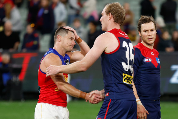 Dayne Zorko and Harrison Petty shake hands after Thursday’s game.