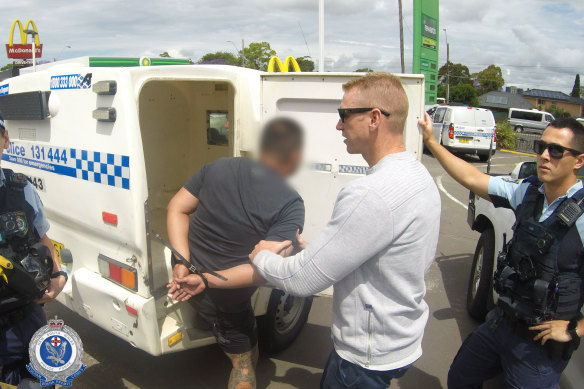 One of the men being arrested on Friday.