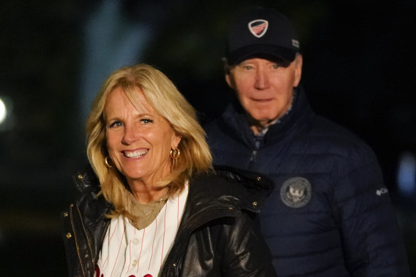 President Joe Biden and wife Jill walk outside the White House after stepping off Marine One on Sunday.