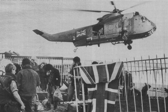 A British Royal Navy helicopter lifts off with some of the evacuees.
