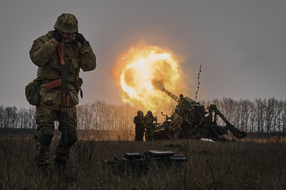 Ukrainian soldiers fire a Pion artillery system at Russian positions near Bakhmut.
