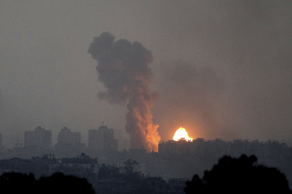 Fire and smoke rise following an Israeli airstrike in the Gaza Strip on Saturday.