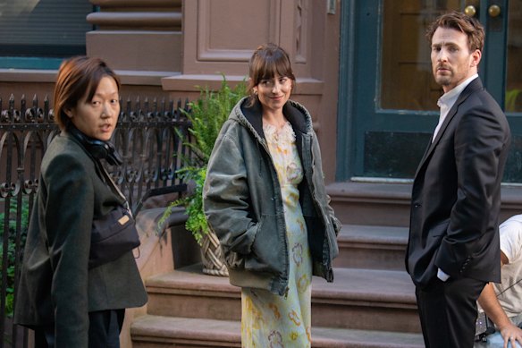 Celine songs, the left, during the filming with Dakota Johnson and Chris Evans. 