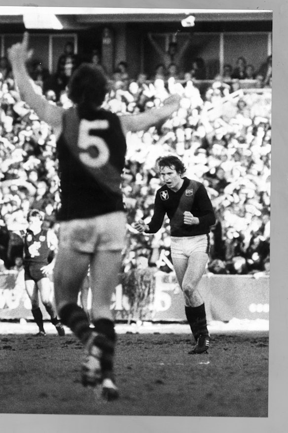 Essendon’s Neale Daniher (right) after booting the late match-saving goal at Princes Park, looks up to see brother Terry Daniher (number 5) celebrating on August 16, 1981. 