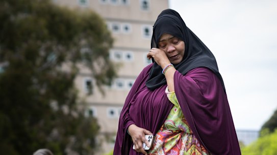 Public housing resident Aisha Abdi addresses the rally on Saturday.