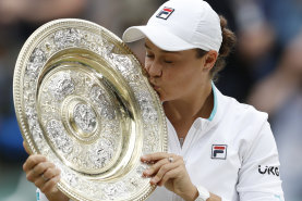 Ash Barty kisses the Wimbledon trophy after ending the 41-year drought for Australian women at the tournament in 2021.