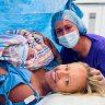 Baby Angus, his intended mother Edwina Peach, and his surrogate mother Jennifer McCloy moments after Angus’ birth in November 2022. The two women are campaigning for change to make surrogacy more accessible in Australia.