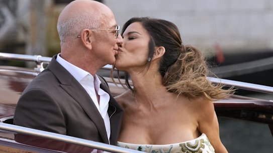 Bezos and Sánchez are pictured here sharing a kiss as they leave their hotel in Venice for a pre-wedding reception.