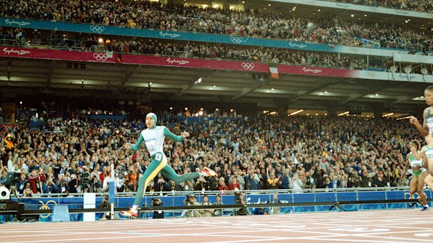 Cathy Freeman crosses the line to win the 400m at the Sydney Olympics.