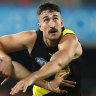 Tigers lock in premiership ruckman as clubs make list decisions