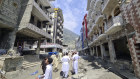 Houses damaged by floodwaters in northern Pakistan. China’s central bank is extending emergency loans to Pakistan.