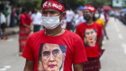 People wear T-shirts imprinted with the image of Myanmar leader Aung San Suu Kyi, during the 73rd anniversary of the 1947 assassination of Myanmar independence heroes. 