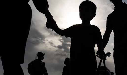 Waiting to board a Royal Australian Air Force flight at Kabul airport. 