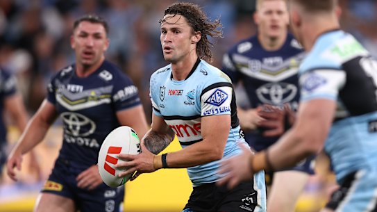 Mr 100: Sharks halfback Nicho Hynes celebrates a milestone on Saturday night.