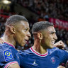 Kylian Mbappe and Achraf Hakimi celebrate a goal from the latter for PSG.