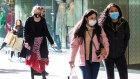 Shoppers in masks on Sydney’s Pitt Steet. Retail will be one of the first beneficiaries of the reopening.