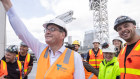 Premier Daniel Andrews welcomed by tradies at the construction site for Footscray hospital.