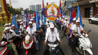 Supporters of Cambodian Prime Minister Hun Sen's People's Party parade in Phnom Penh.