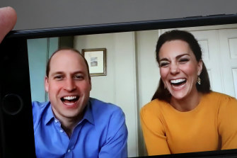 Prince William, Duke of Cambridge pictured on April 9, 2020, in a video chat with school students, alongside Catherine, Duchess of Cambridge. Sources say he contracted coronavirus in April. 