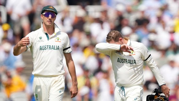 Australia’s Steve Smith (right) reacts in pain after getting hurt while fielding on day three of the World Test Championship final. 