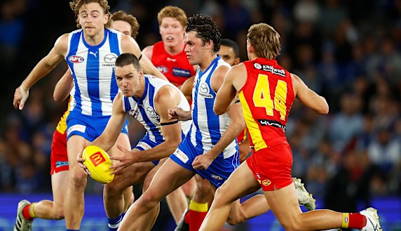 North Melbourne young gun Luke Davies-Uniacke (with ball) has signed a two-year contract extension.