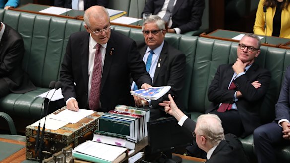 Prime Minister Scott Morrison hands over the Closing the Gap report.
