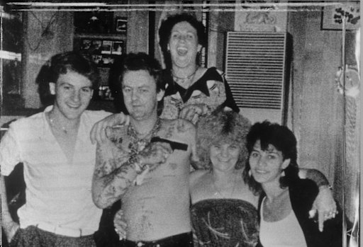 Family fun: Dennis Allen points a gun at his mother, Kath Pettingill.
