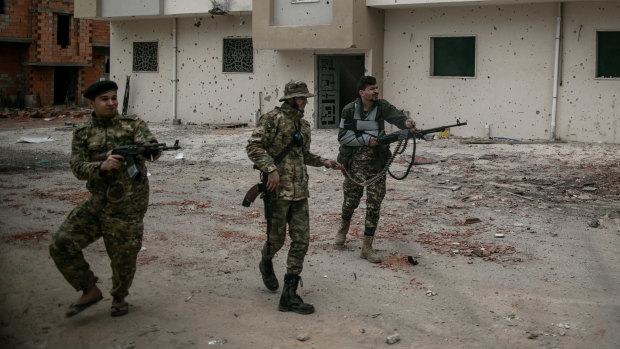 Fighters of Libya's recognised government fire at LNA troops in Salah al-Din, Tripoli, last week.