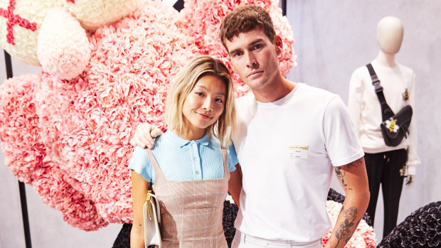 Genetically-blessed couple Yan Yan Chan and Nathan Jolliffe pose alongside the Dior figurine. 