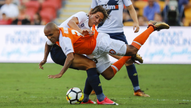 Lachlan Wales of the Mariners and Henrique of the Roar compete for the ball during their round 25 A-League match at Suncorp Stadium in Brisbane on Saturday.